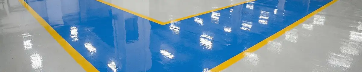 A factory floor professionally covered and marked with epoxy flooring in Shreveport, LA