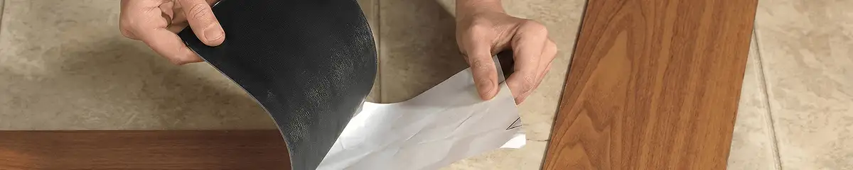A professional installing vinyl flooring in Shreveport, LA